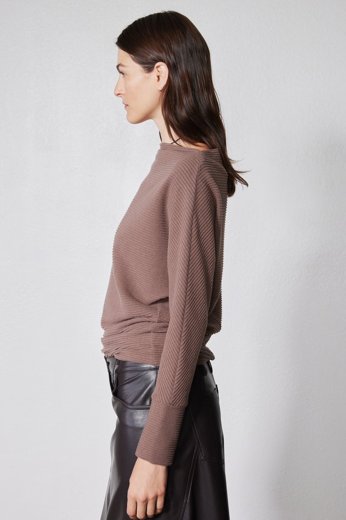 Medium taupe brushed rib dolman top in side profile with mock neck and long sleeves