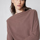 Medium taupe brushed rib dolman top close-up with mock neck and folded sleeve