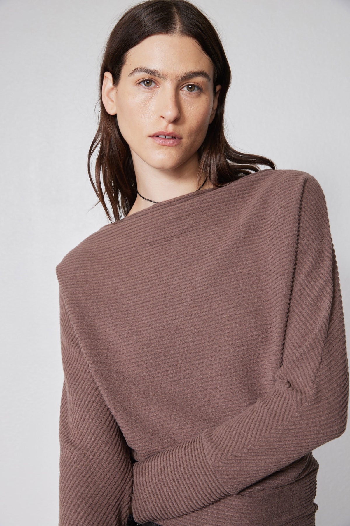 Medium taupe brushed rib dolman top close-up with mock neck and folded sleeve