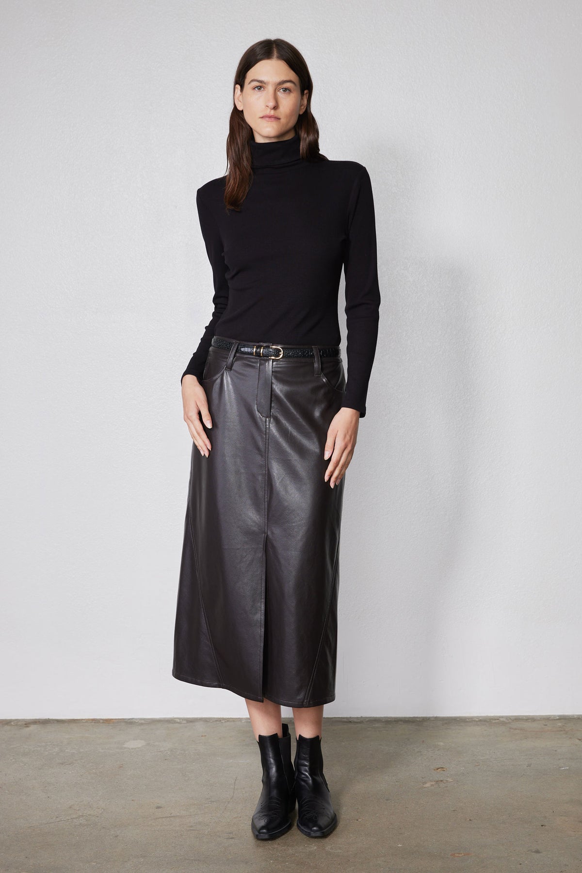 Black fitted turtleneck top with long sleeves and ribbed brushed knit texture