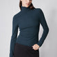 Forest green ribbed turtleneck long-sleeve top with high collar and snug fit
