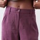 Deep purple pants with button closure, belt loops, and side pocket
