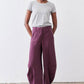 Deep purple wide-leg pants with relaxed fit and elastic waist