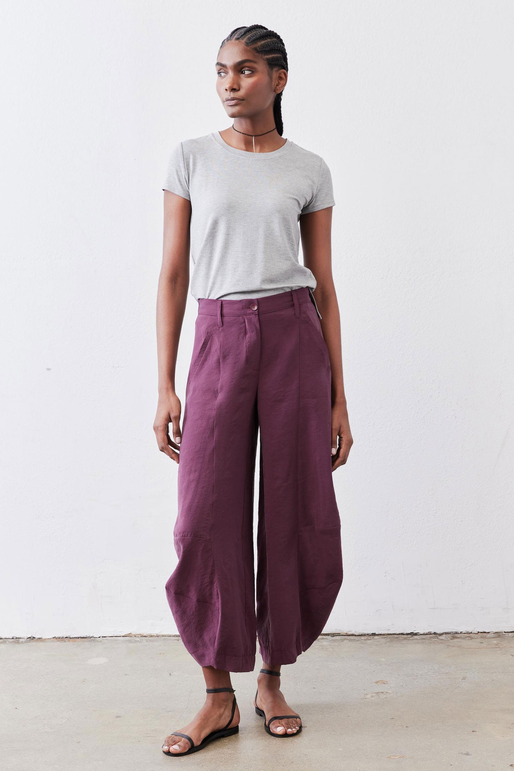 Deep purple wide-leg pants with gathered elastic waist and button closure