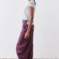Deep purple wide-leg pants with roomy legs and ankle-length hem