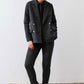 Charcoal herringbone double-breasted blazer with gold buttons and long sleeves
