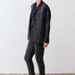 Charcoal longline herringbone vest shown from side with gold button closure