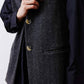 Charcoal herringbone vest front with gold buttons and welt pocket