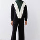 Chevron colorblock turtleneck sweater in forest green, cream, and black with relaxed fit.