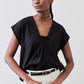 Black cinched-neck poplin top with gathered center front and short sleeves, close-up
