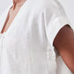 White poplin top shoulder and neckline detail with cinched drawstring