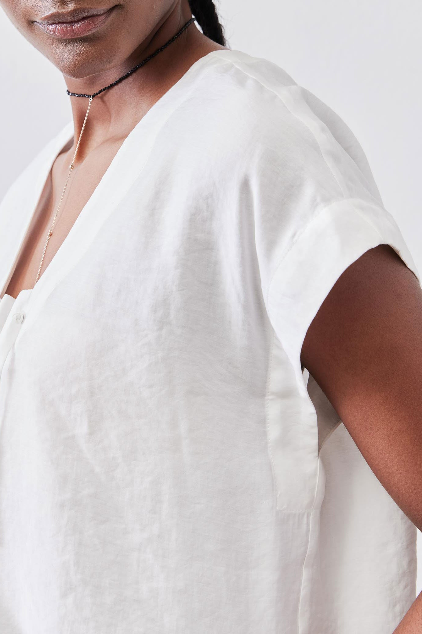 White poplin top shoulder and neckline detail with cinched drawstring