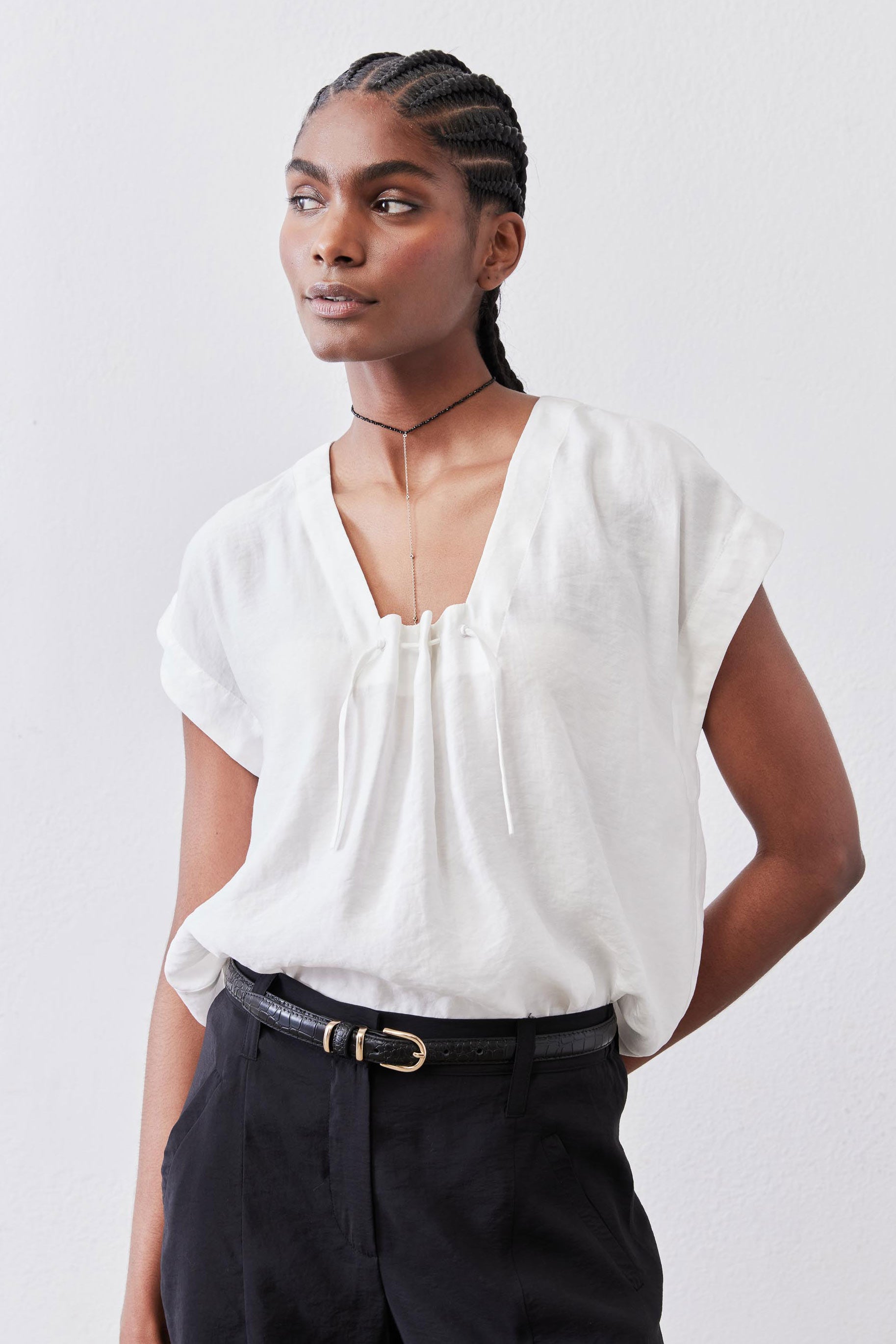 White light poplin top with cinched neckline and drawstring, short puff sleeves
