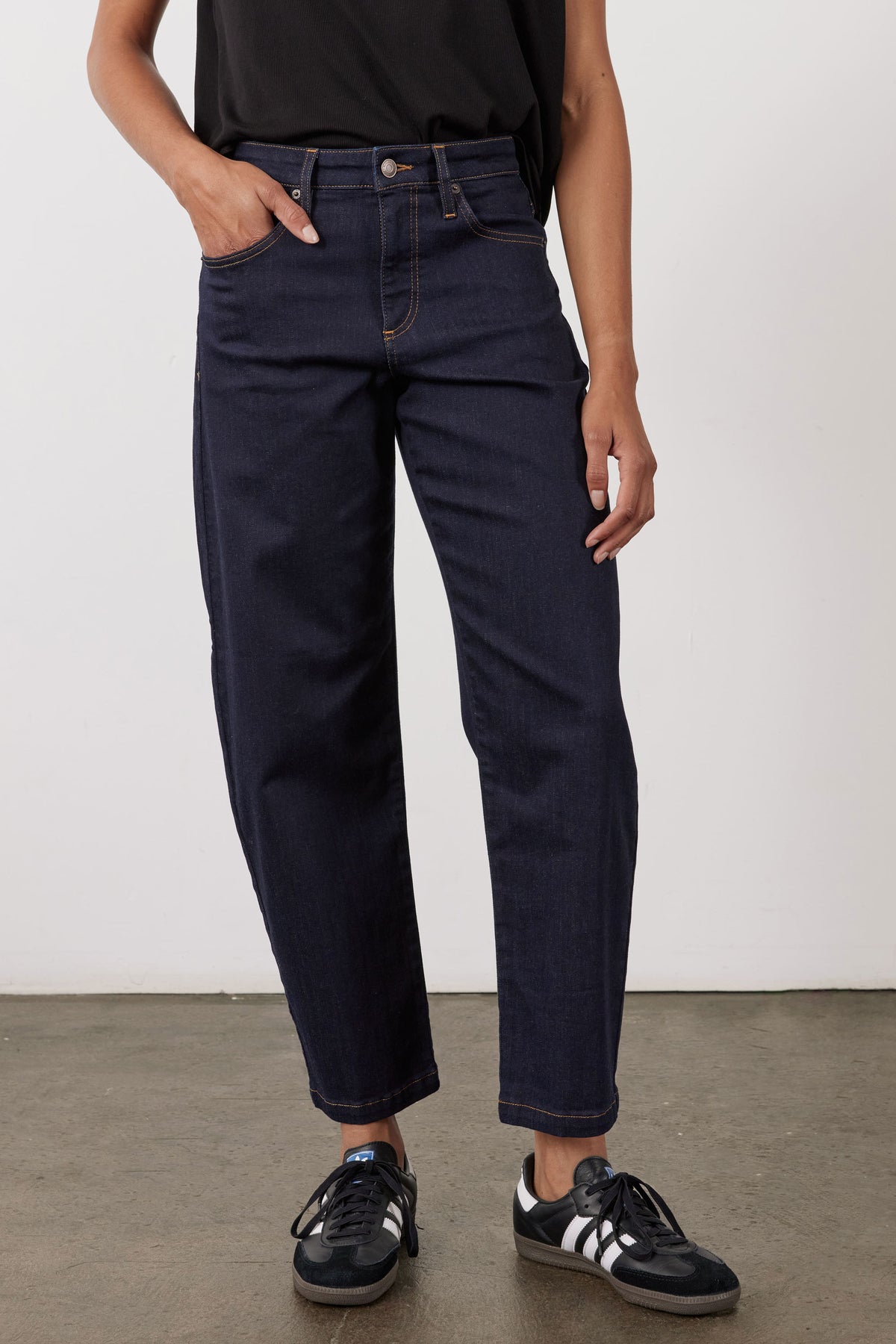 Petite dark wash barrel leg jeans, full front view with cuffed hem