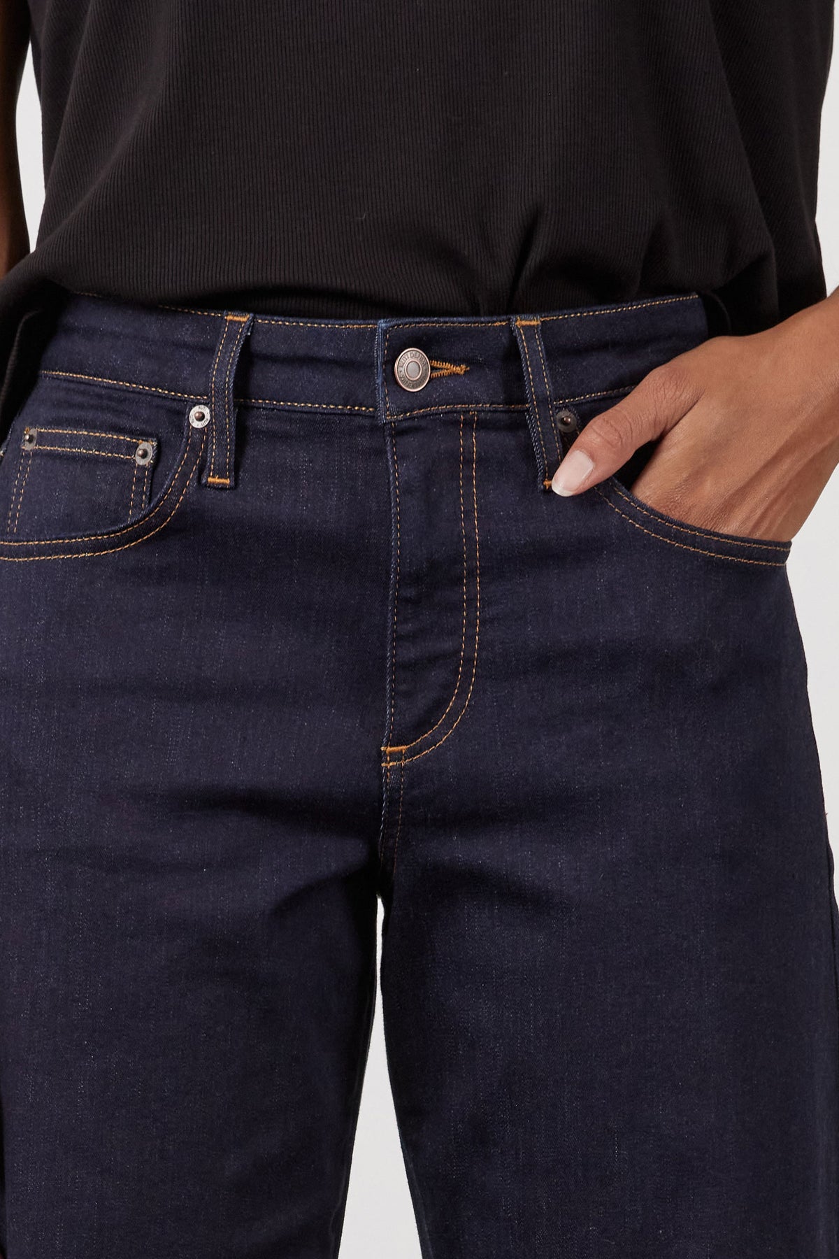 Dark wash petite barrel leg jeans with button waist and belt loops, front close-up
