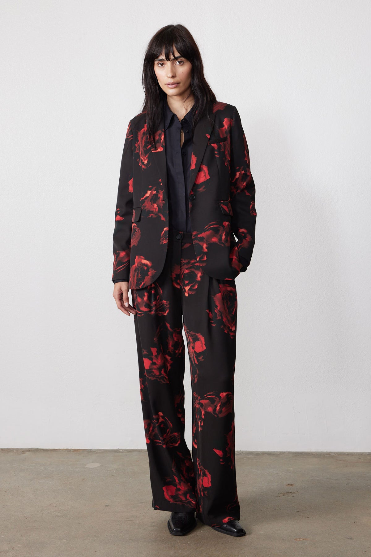 Black blazer with red floral rose print, notch lapels and button front