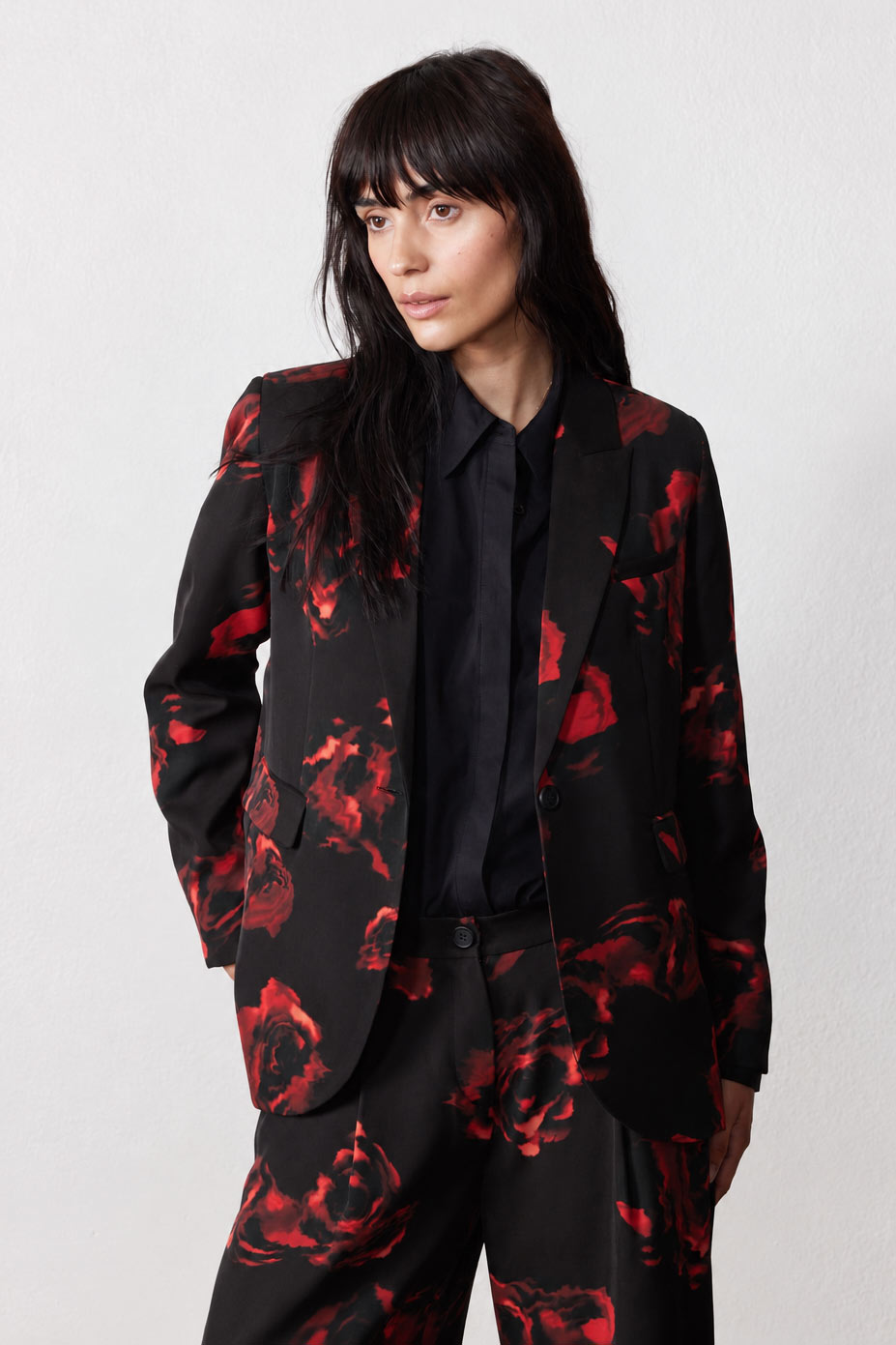Black rose-print blazer with notch lapels and button front, front view