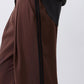 Brown wide-leg pleat pants with vertical black stripe and relaxed waist