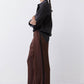 Dark brown wide-leg pants with black piping at side seams and button front