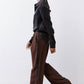 Brown wide-leg trousers with black side stripe and relaxed straight fall