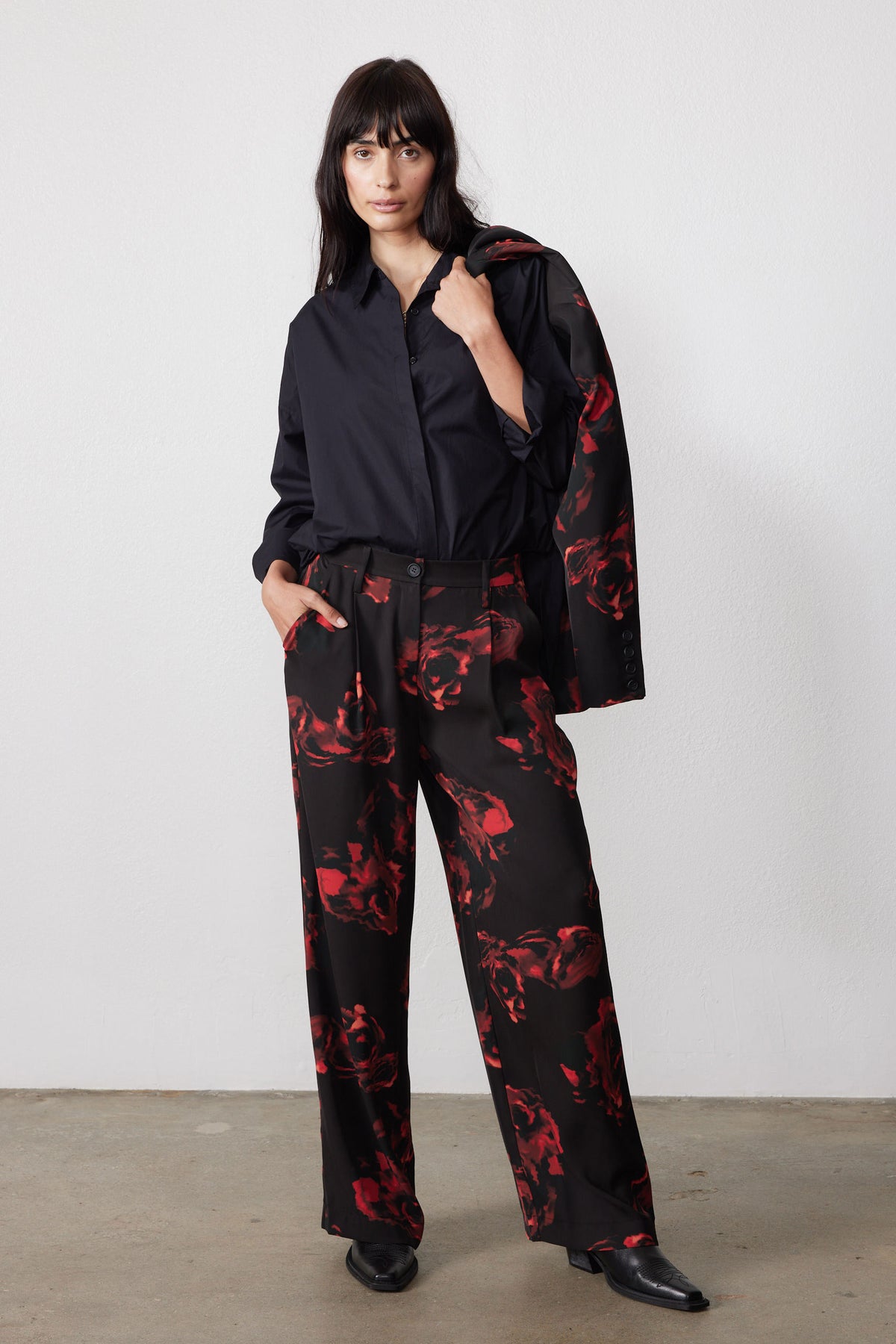 Wide-leg pleated pants with red rose print on black, straight relaxed legs