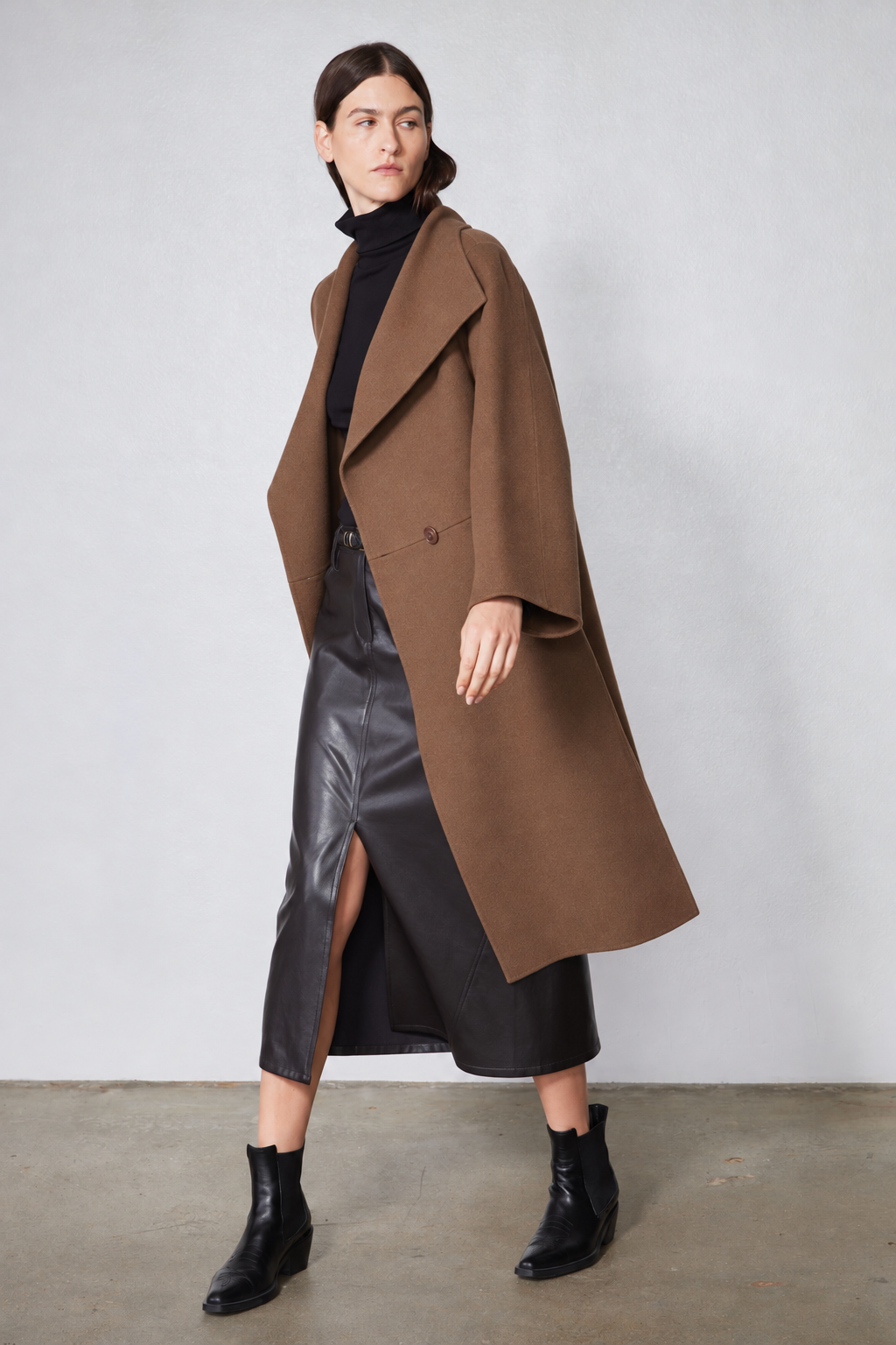 Dark taupe oversized wool coat with notched collar, two-button front, side slit
