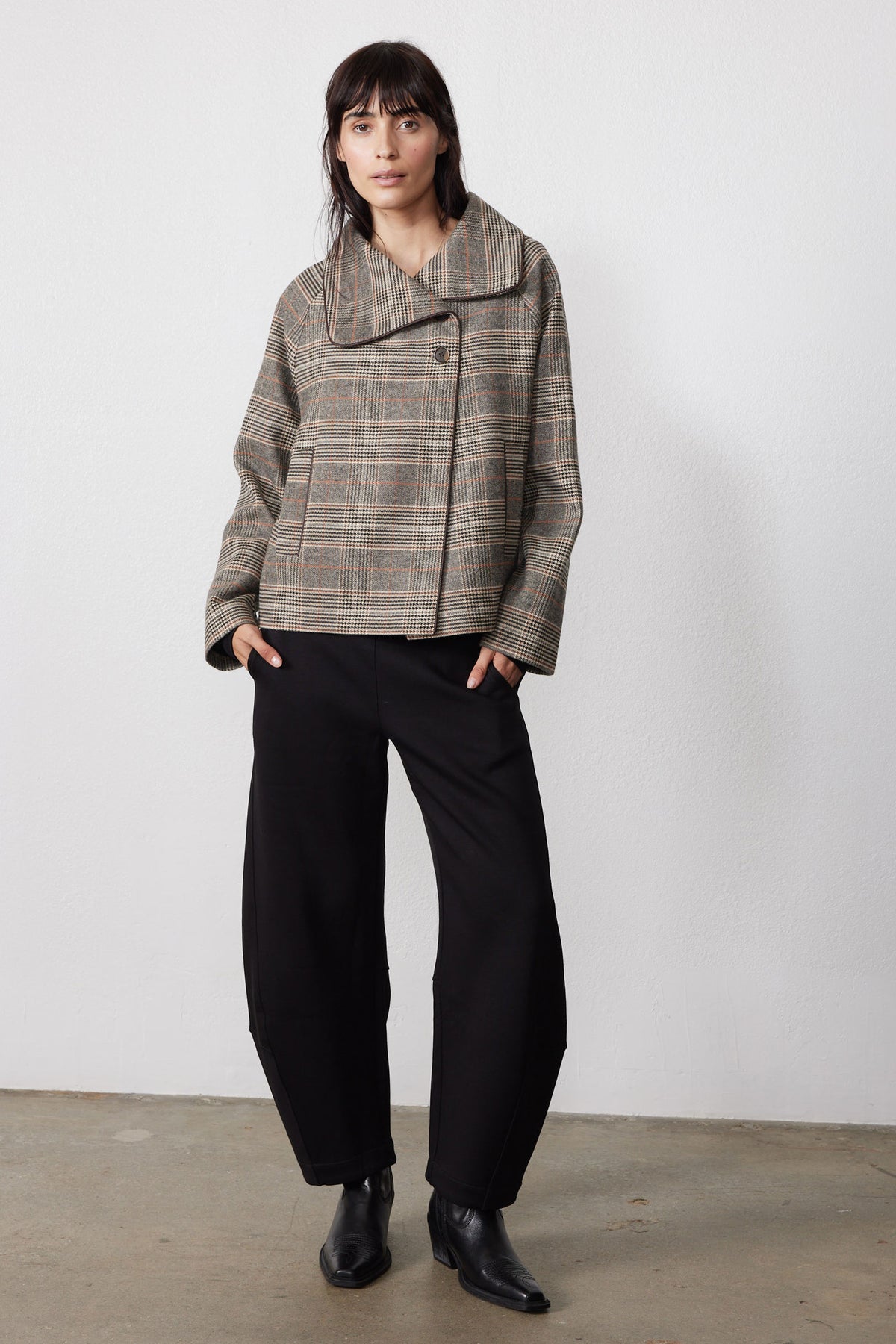 Brown plaid asymmetric collared jacket with button front and long sleeves