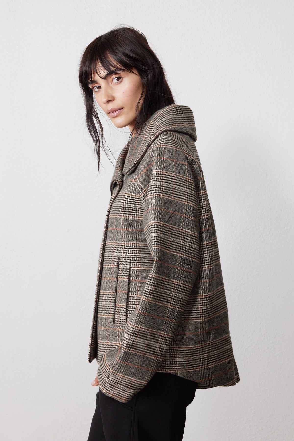 Brown plaid asymmetric collared jacket shown from the side