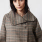 Brown plaid asymmetric collared jacket close-up, button and yoke detail