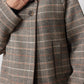 Brown plaid jacket detail: notched collar and button front placket