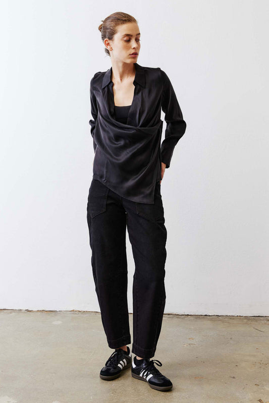 Black collared wrap silk blouse, long sleeves and front wrap, side profile