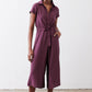 Maroon cropped jumpsuit with short sleeves, V-neck, and tied waist