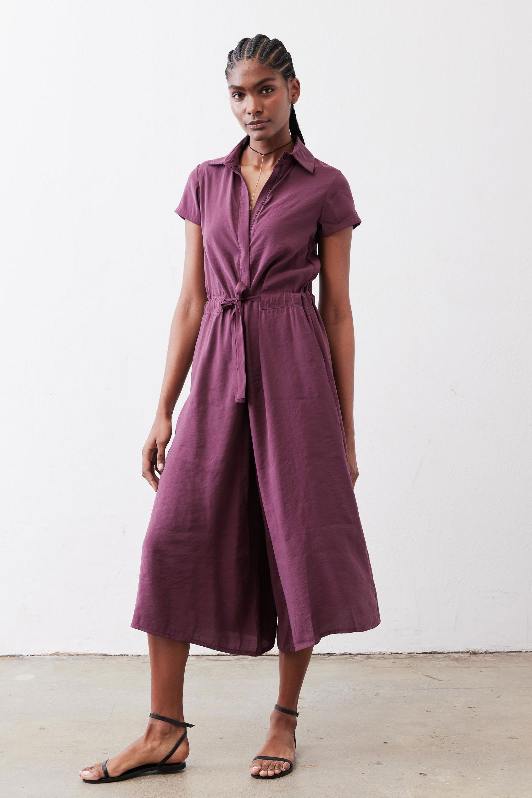 Maroon cropped wrap-style jumpsuit with belt tie and wide cropped legs