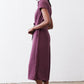 Maroon cropped jumpsuit with short sleeves and front drawstring waist tie