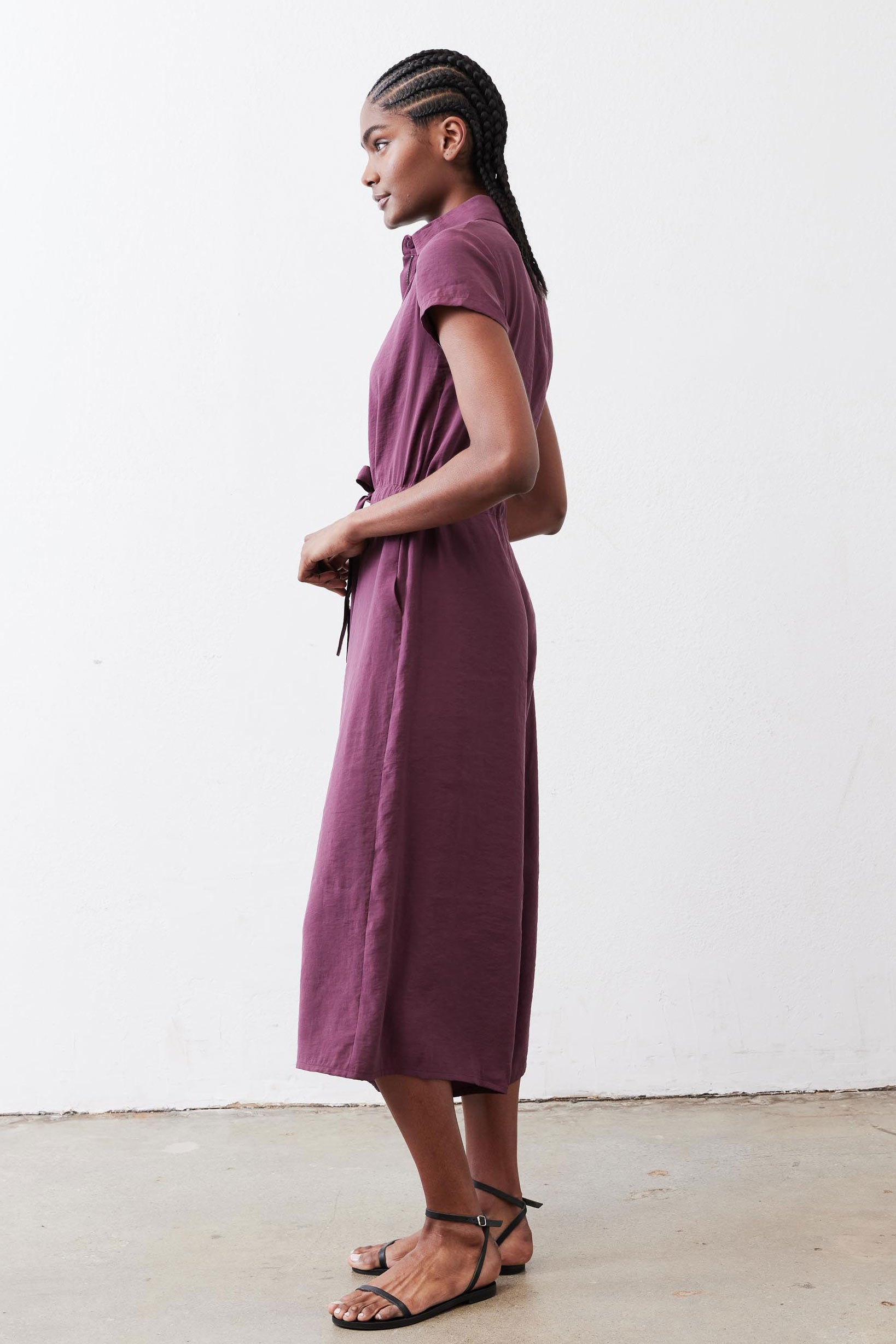 Maroon cropped jumpsuit with short sleeves and front drawstring waist tie
