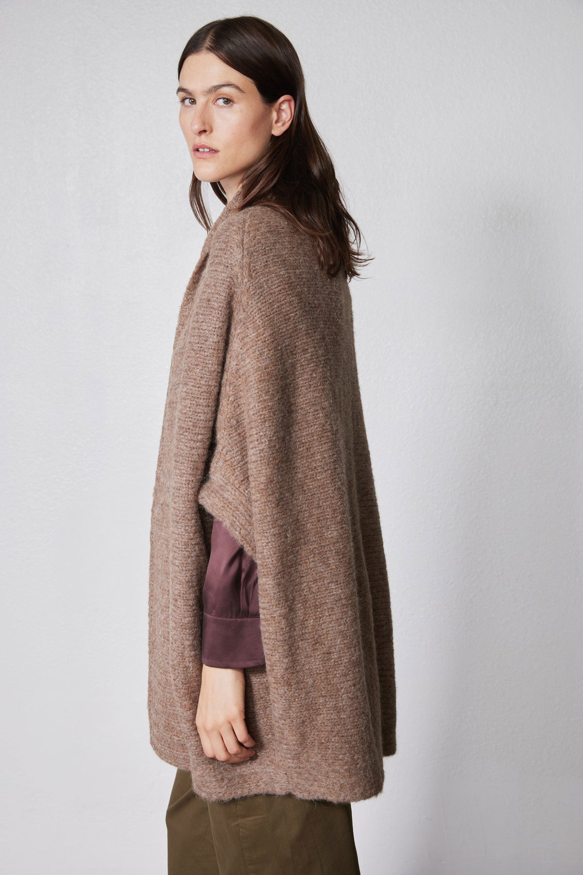 Taupe melange dolman cardigan side view with open front, textured knit hem.