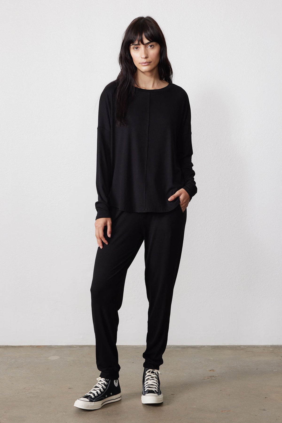 Black ribbed pajama set with a relaxed long-sleeve top and tapered pants