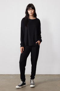 Black ribbed pajama set with a relaxed long-sleeve top and tapered pants