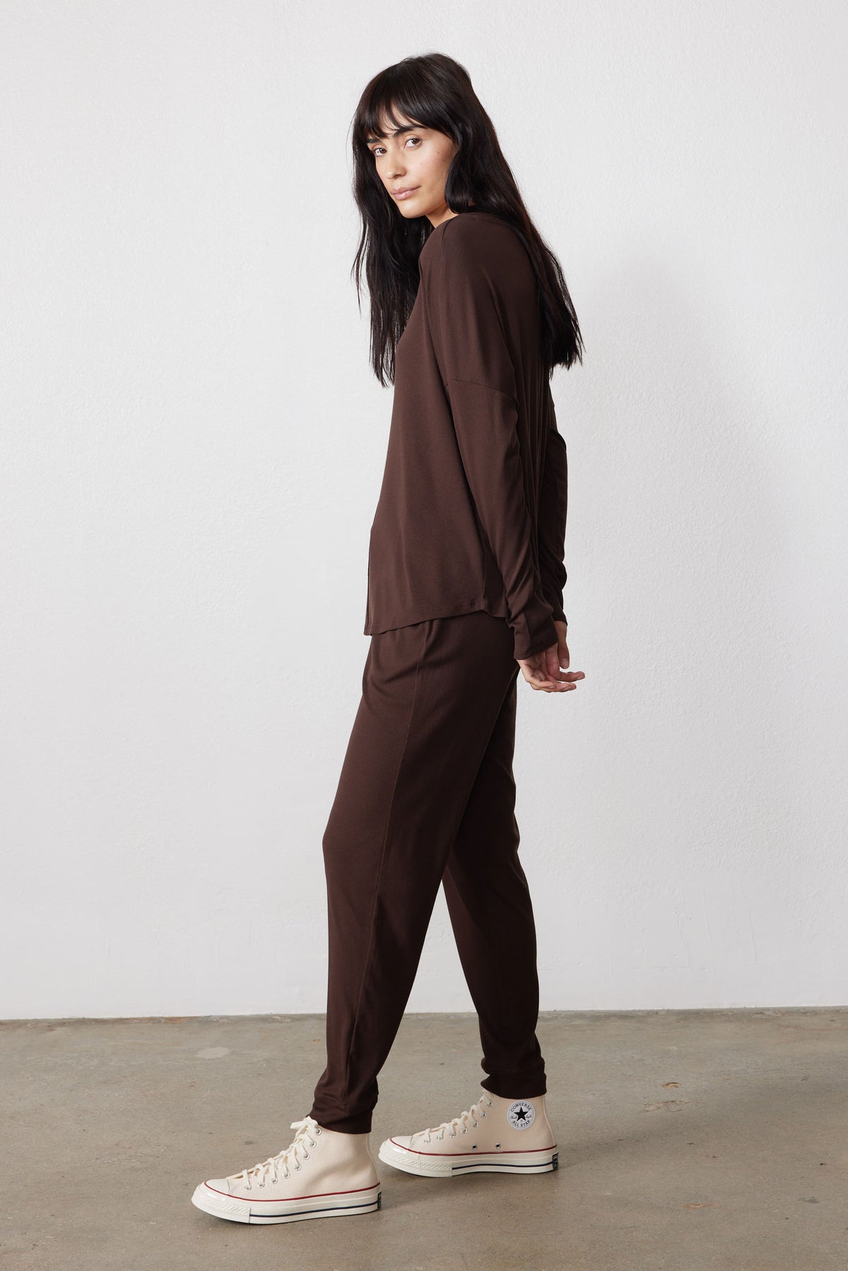 Chocolate pajama set shown from the side, with a loose top and straight-leg pants
