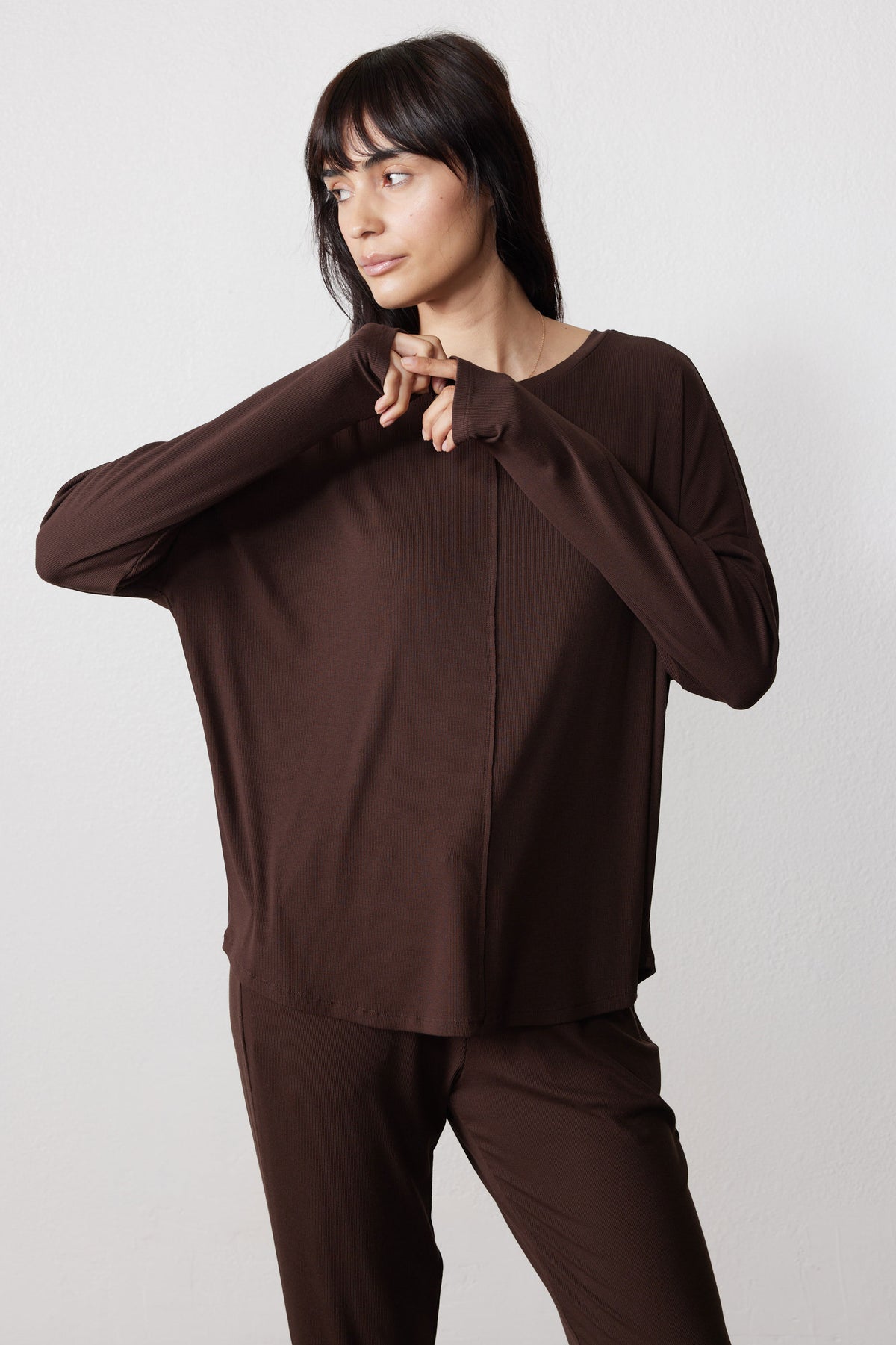 Chocolate pajama top with long sleeves and a relaxed fit, paired with matching pants