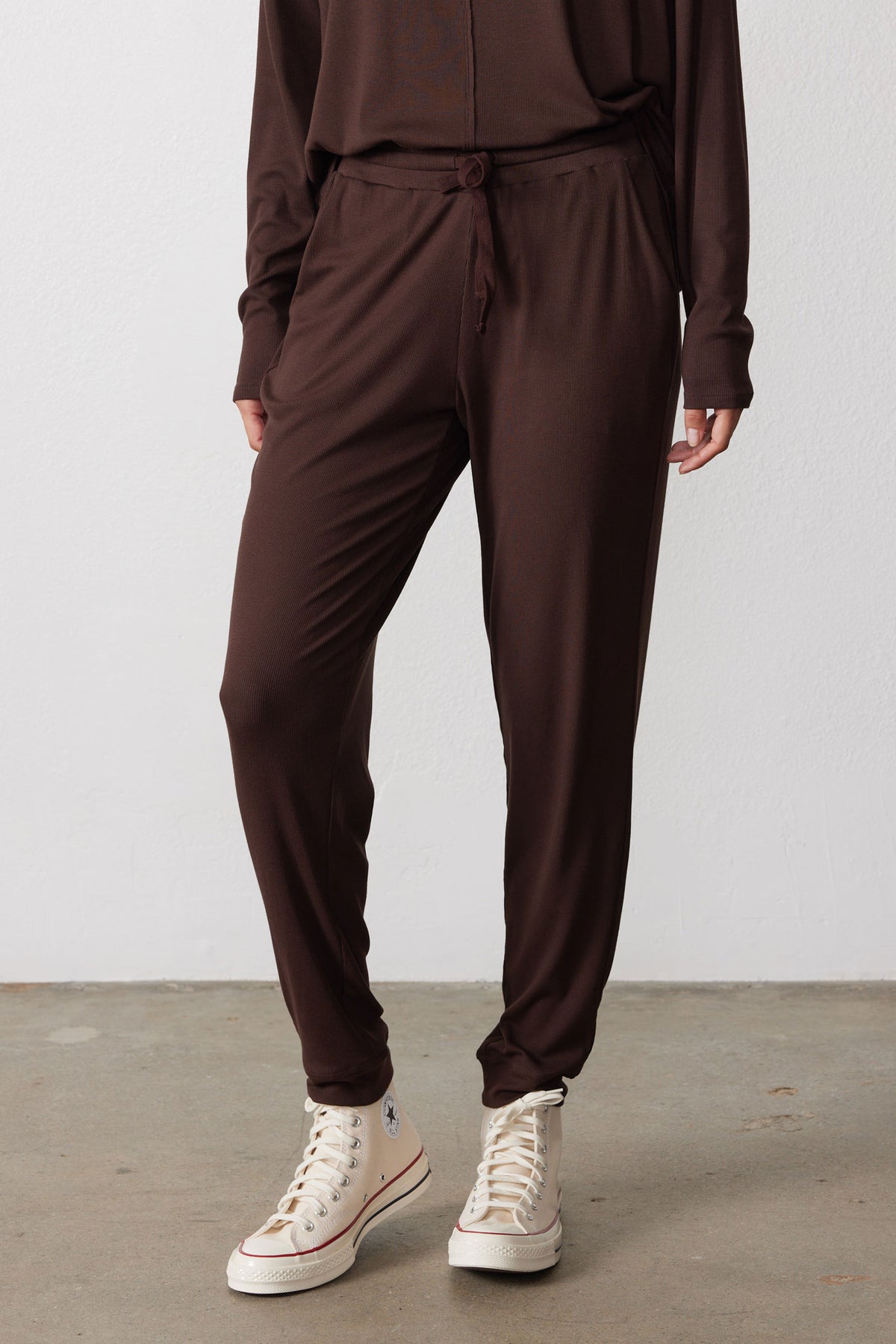 Chocolate pajama pants with a drawstring waist and tapered legs