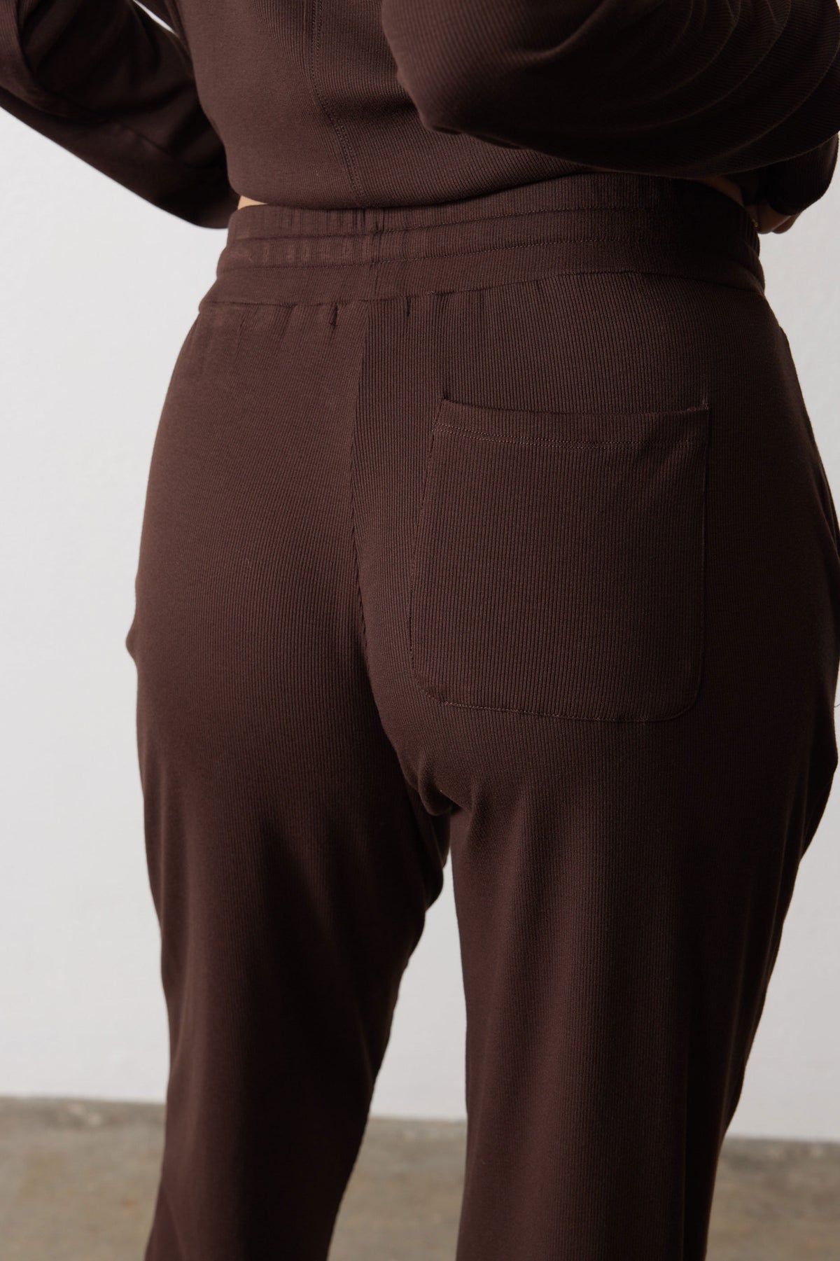 Close-up of the pajama pants' elastic waistband and single back pocket