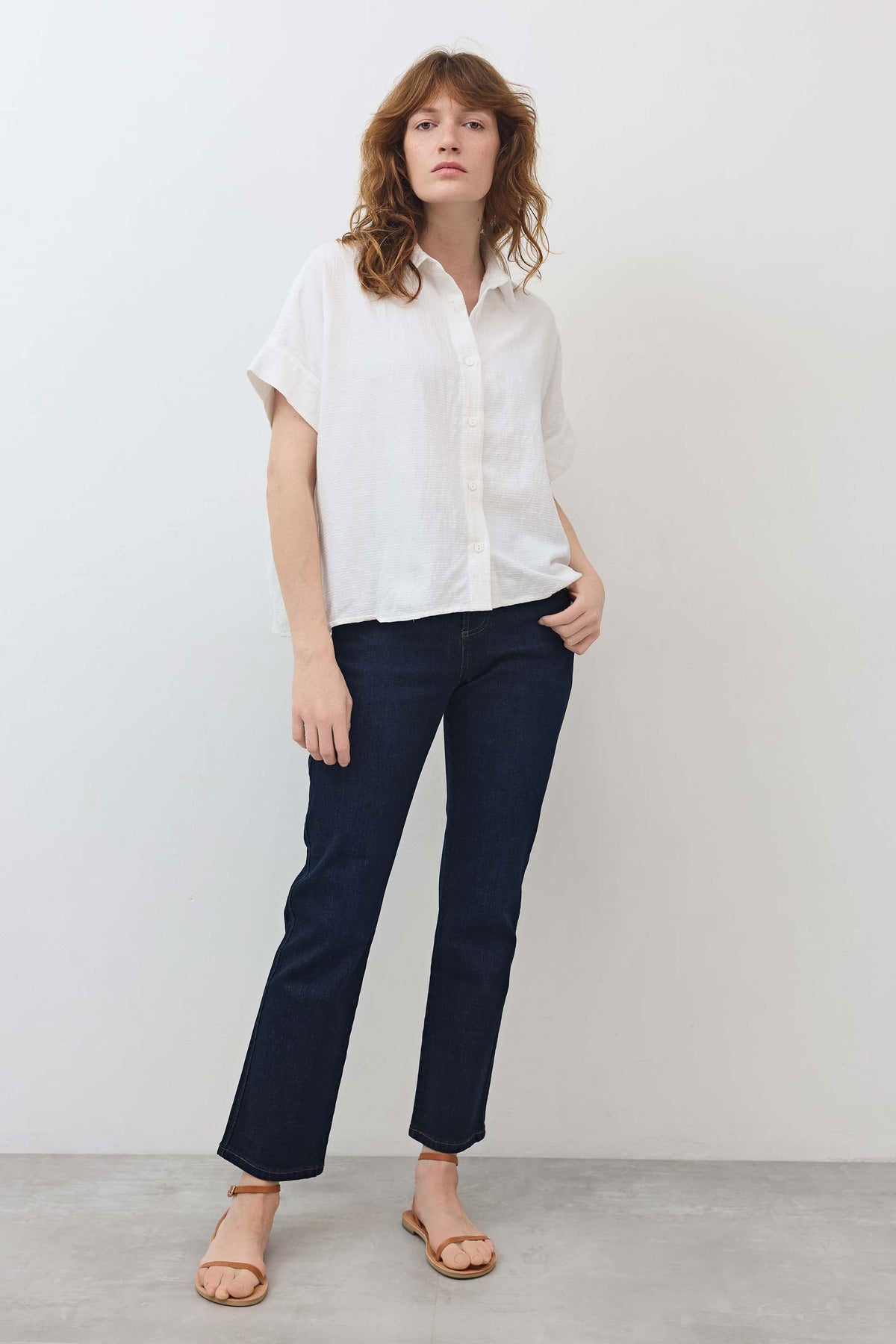 Dark wash mid-rise straight jeans, straight cropped legs with belt loops