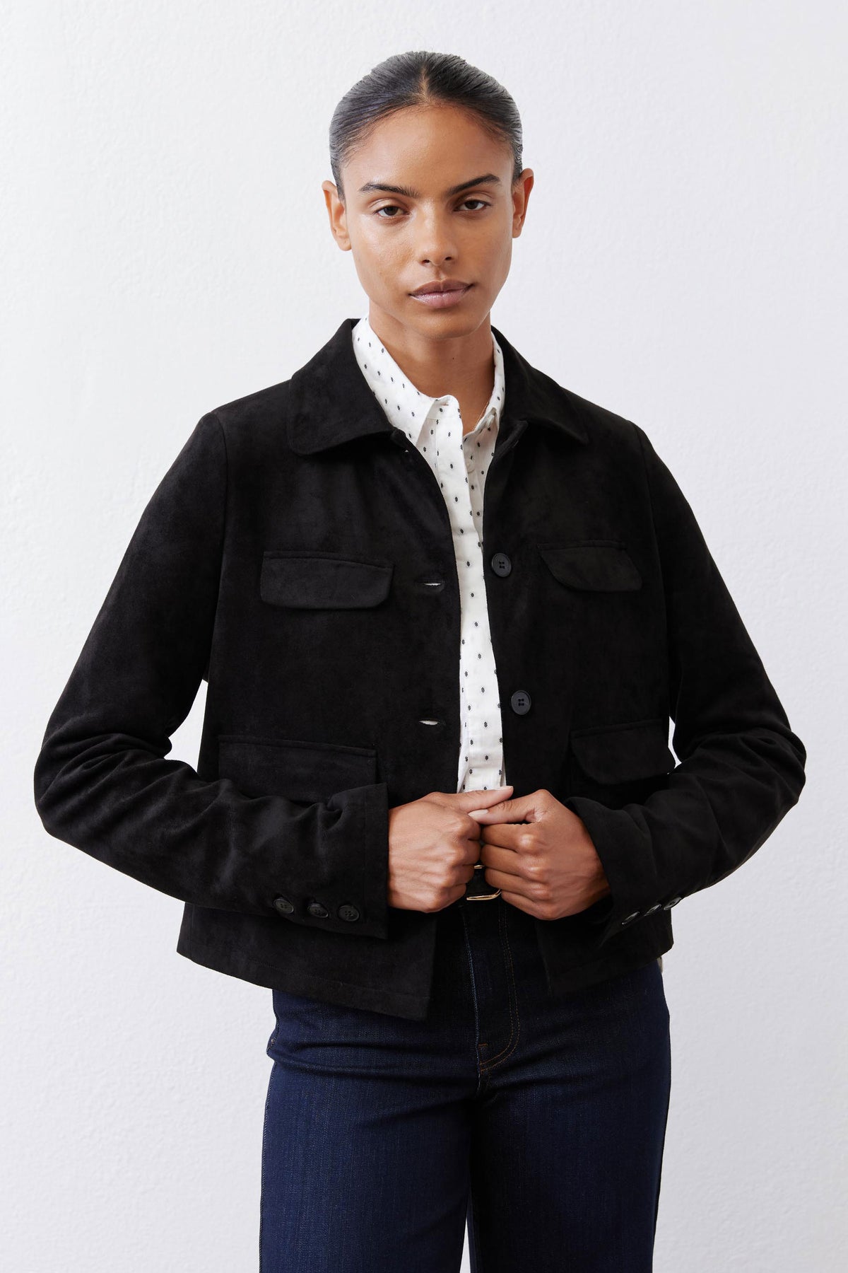 Black cropped suede jacket with button front and flap pockets, front view