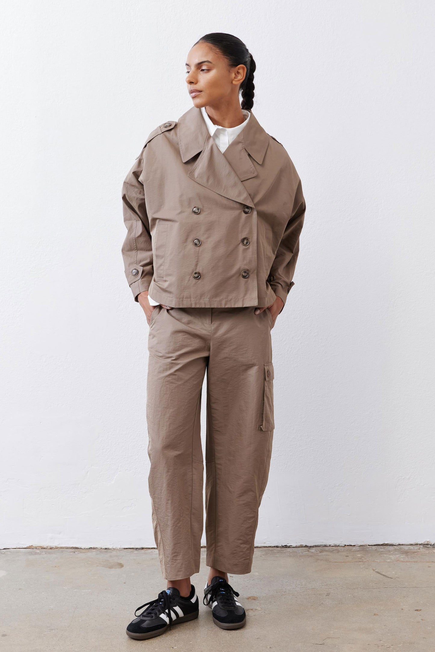 Oversized walnut nylon trench coat with double-breasted front and wide lapels