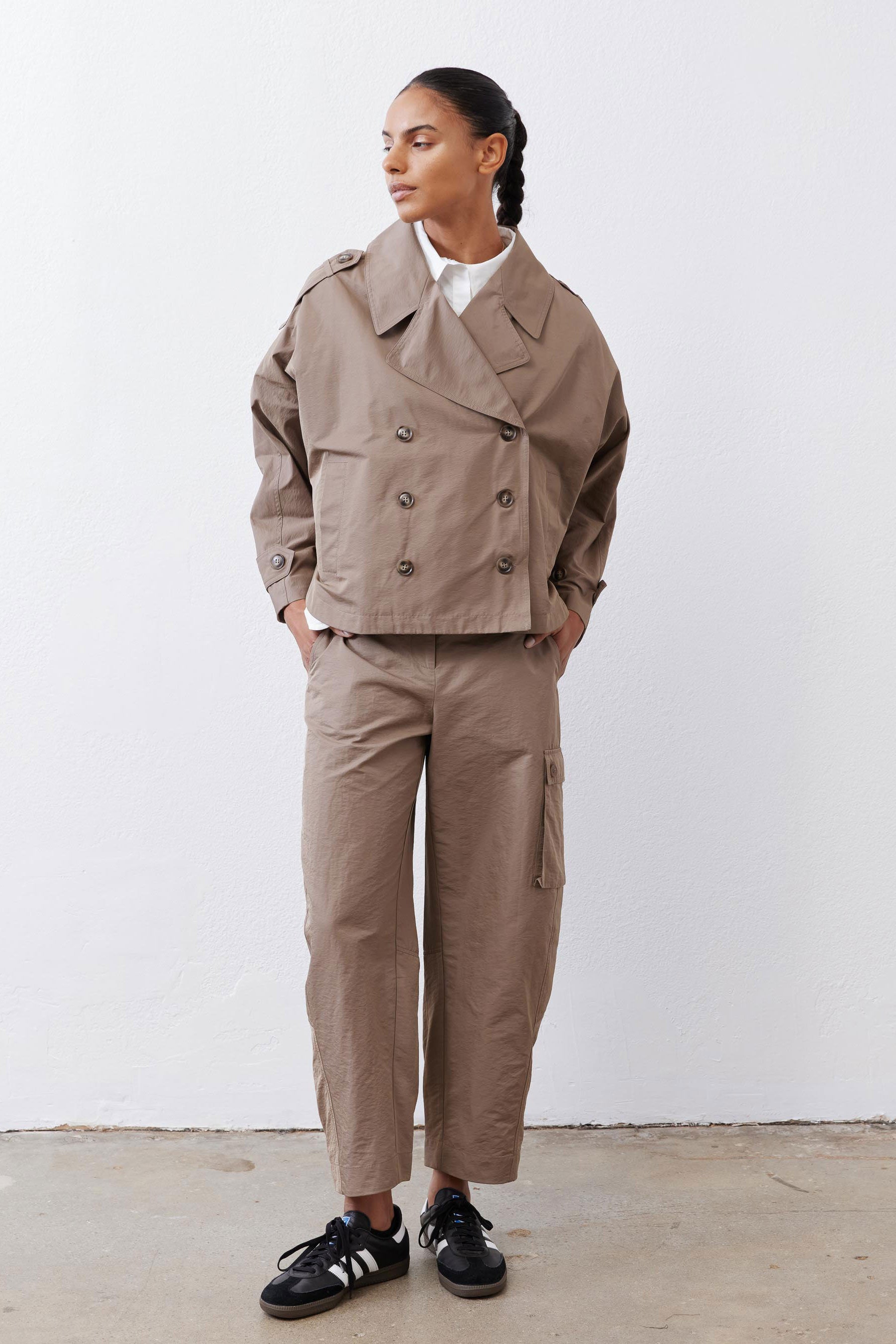 Oversized walnut nylon trench coat with double-breasted front and wide lapels