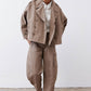 Walnut oversized trench coat, open front with buttoned flap pockets and dropped hem