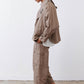 Walnut trench coat side view with point collar and buttoned cuffs