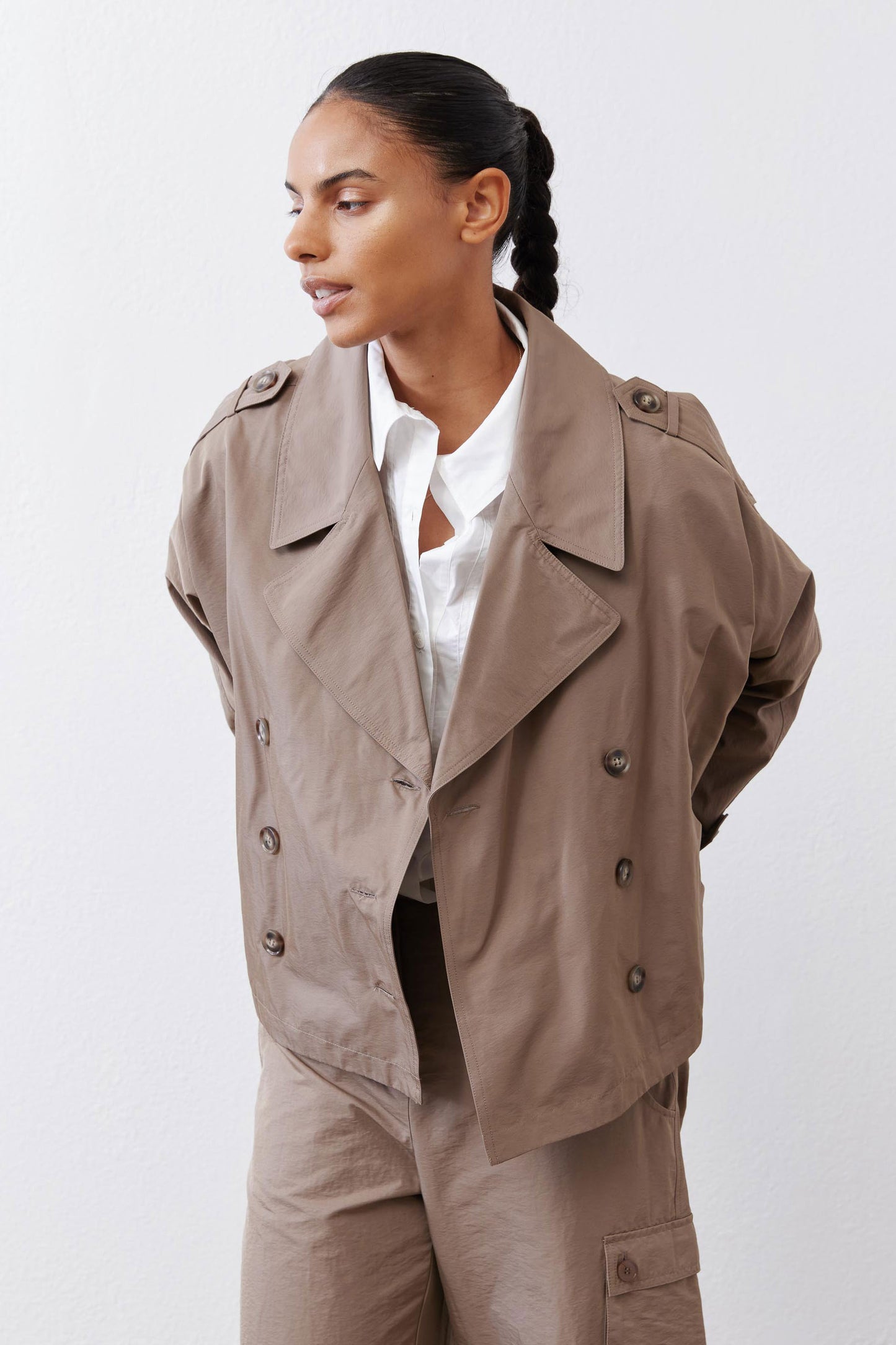 Walnut nylon trench coat close-up with open front, structured lapels, and buttons