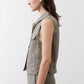 Olive green cropped task vest side view, sleeveless with button front and pockets